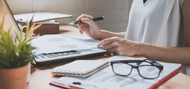 Businesswoman working on&nbsp;Desk office with marketing graph statistics analysis